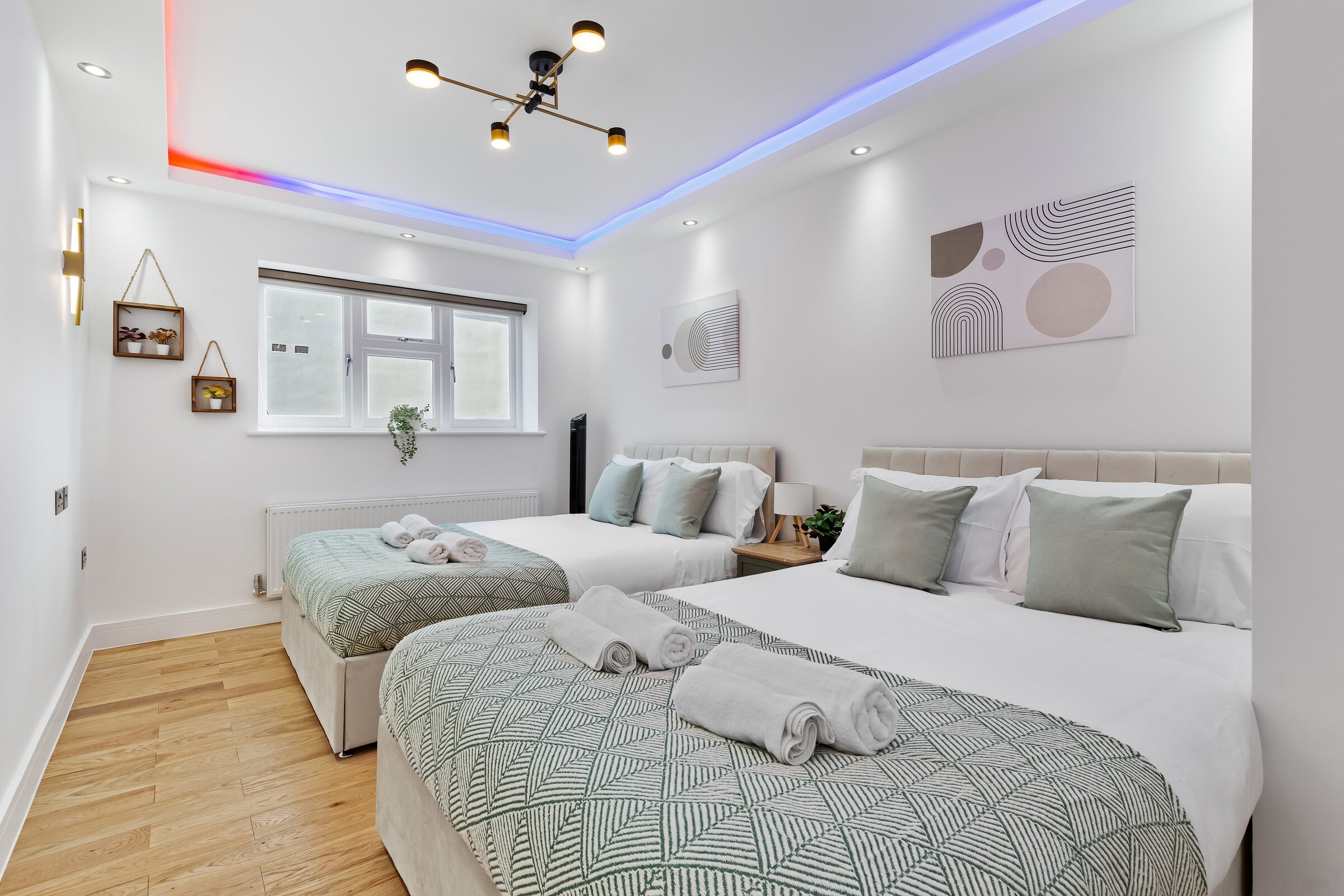 Bedroom 1 — beds with rolled towels
