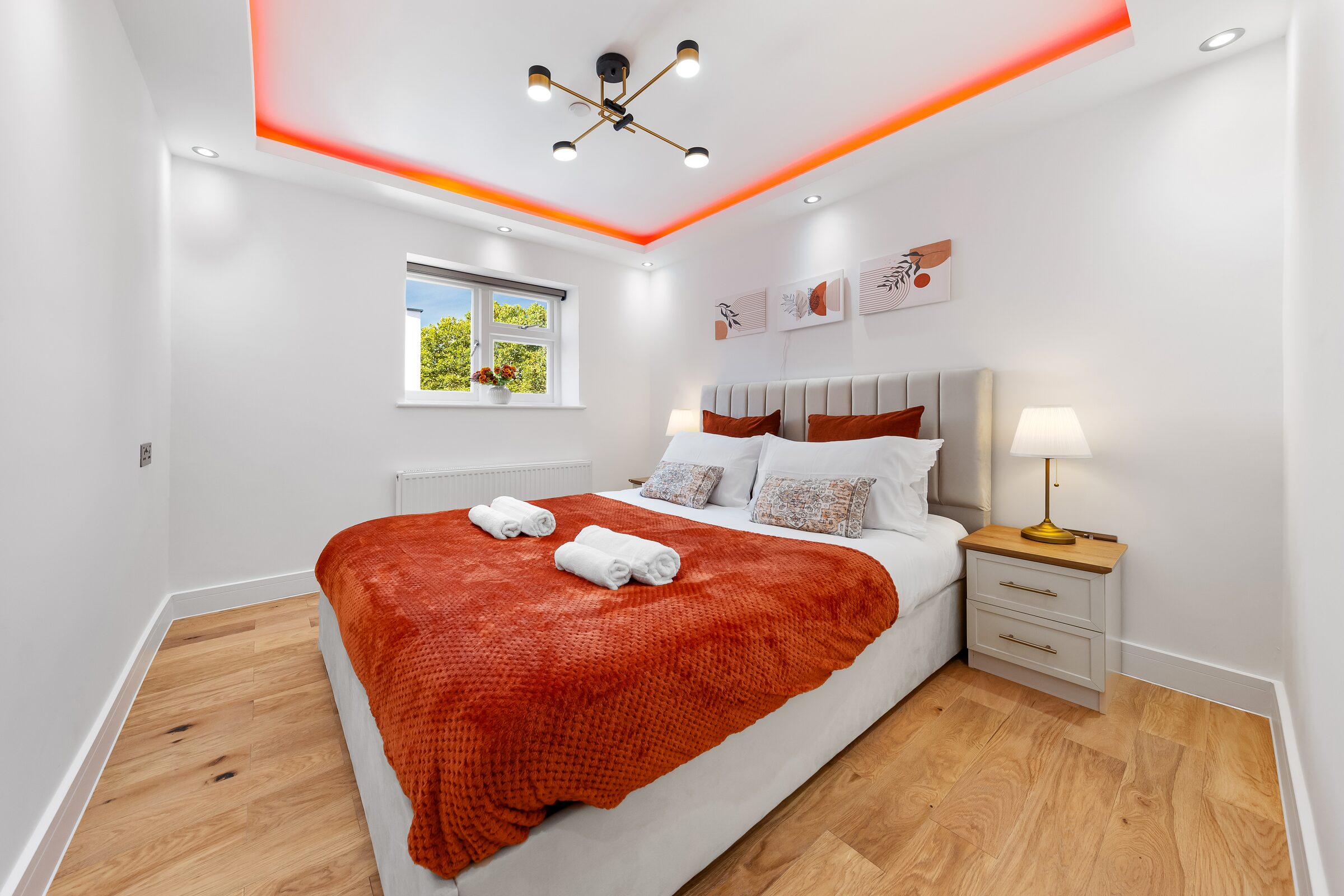 Bedroom 2 — double bed with terracotta throw