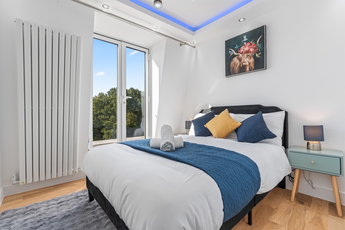 Double bed with blue throw