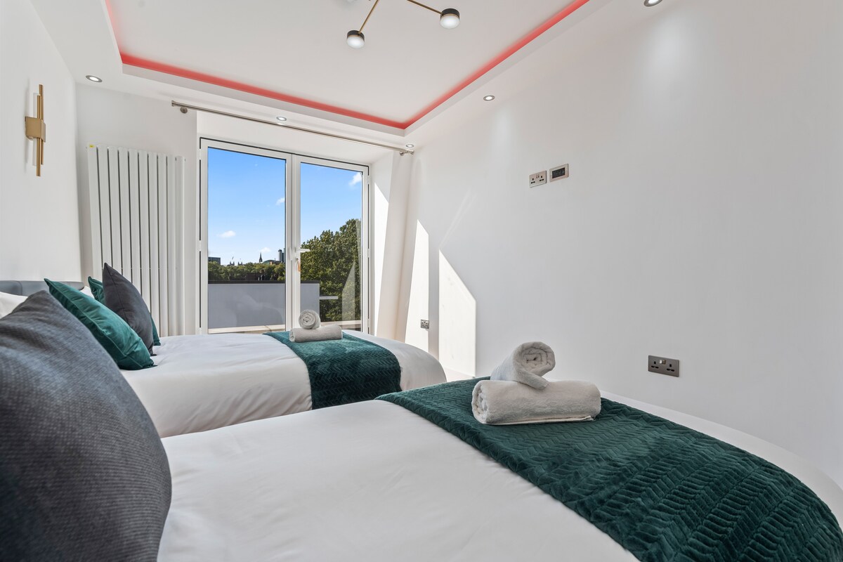 Bedroom 2 — double and single beds by the window
